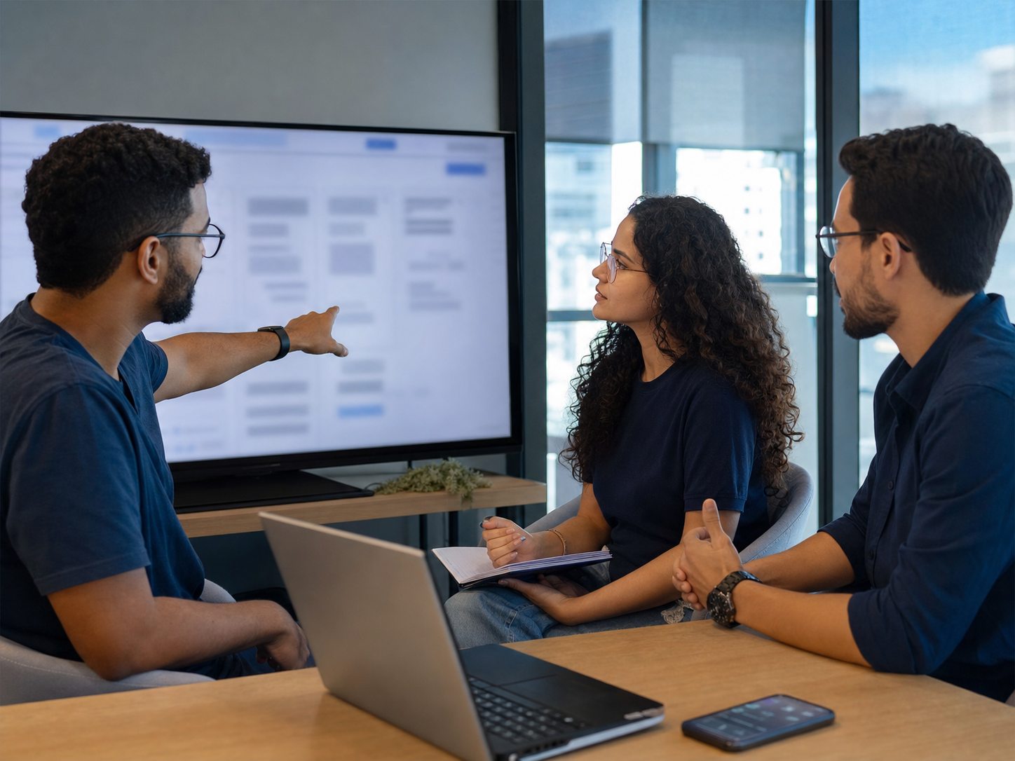 QA professionals reviewing test findings together in an office.
