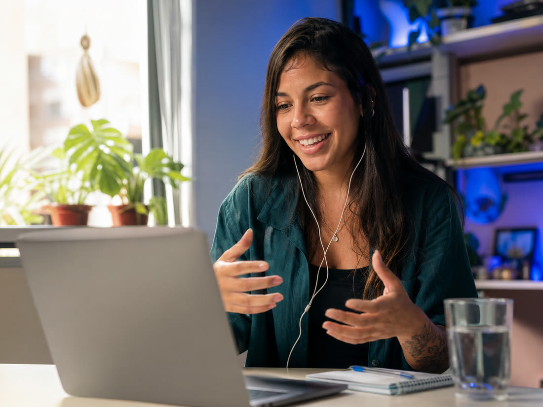 A candidate smiling during a video interview at home